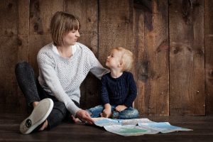 woman tutoring young child