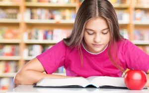 girl studying for literacy assessment